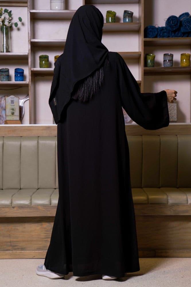 عباية جيوب وتغلق بازرة بلون نحاسي