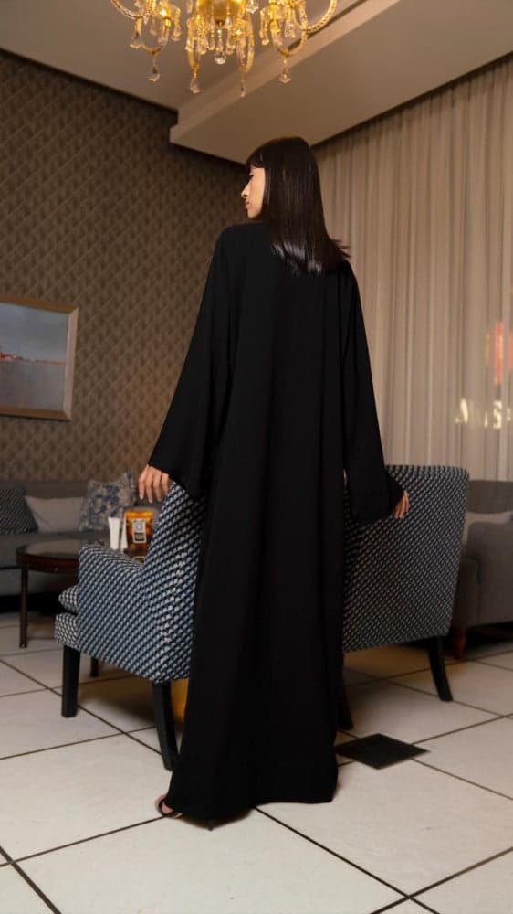 عباية جيوب وتغلق بازرة بلون نحاسي